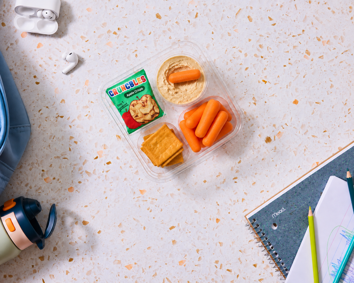 Allergy-friendly snack box with hummus, carrots, pretzels, and dried apples, made gluten-free, nut-free and top-9-allergen-free